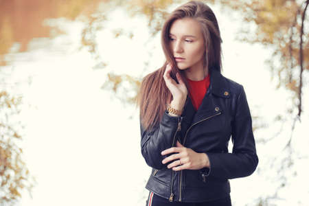 Young girl in autumn parkの写真素材