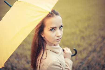 Young girl in autumn parkの写真素材