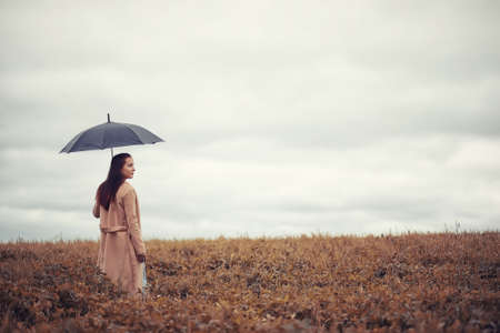 Young girl in autumn parkの写真素材