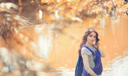 Pregnant woman on a walk in the parkの写真素材