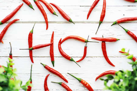 Hot red pepper on white wooden vintage background.の写真素材