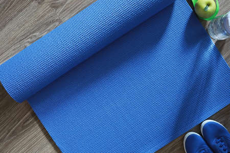 Mat for practicing yoga on a floor. Healthy lifestyle.の写真素材