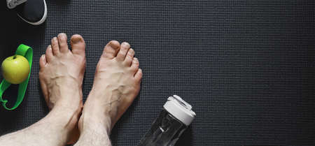 Mat for practicing yoga on a floor. Healthy lifestyle.の写真素材