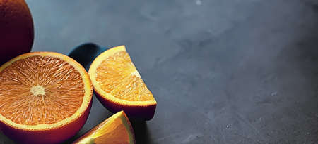Orange citrus fruit on stone table. Orange background.の写真素材