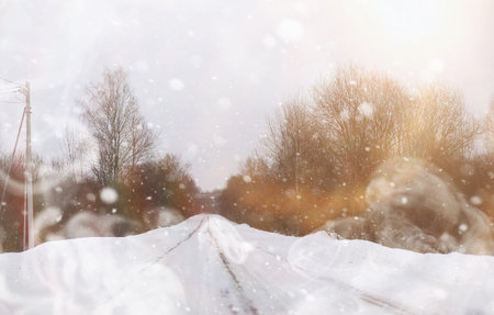 Car on a snowy winter road in the fields.の写真素材