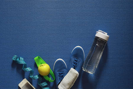 Mat for practicing yoga on a floor. Healthy lifestyle.の写真素材