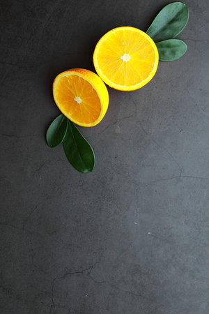 Orange citrus fruit on stone table. Orange background.
