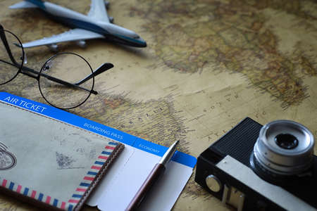 Travel concept. Map on the table and model aircraft.の写真素材