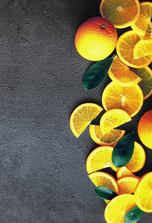 Orange citrus fruit on stone table. Orange background.