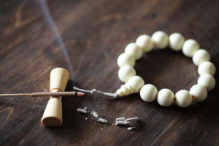 Different objects with traditional religious oriental on a wooden background.の写真素材