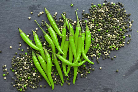 Hot green pepper. Chilean pepper on a black background.の写真素材