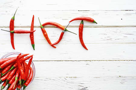 Hot red pepper on white wooden vintage background.の写真素材