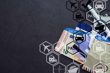 Air ticket and passport for flight by plane. Travel concept Ticket booking.の写真素材
