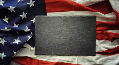 American flag on a black stone background. Space for text.