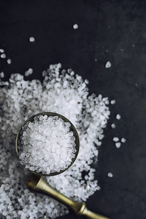 Large sea salt. Spice. Mortar and pestle for grinding salt.