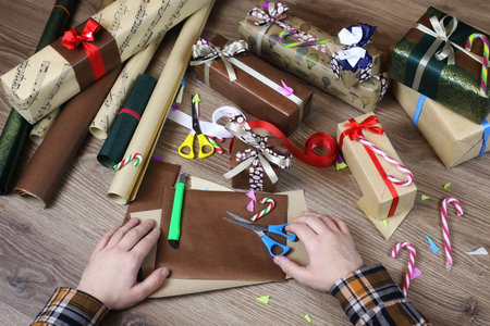 hand gift wrapping paper for the holiday Christmas ribbon and bowsの写真素材