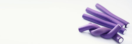 Female colored curlers and hair pins on the tableの写真素材