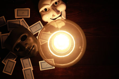 A sorcerer's table with a fortune-teller ball and maskの写真素材