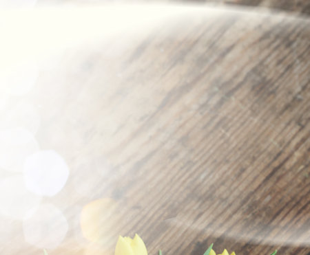 bouquet of yellow tulips in a vase on floorの写真素材