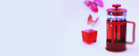 Female drink red warm tea on the tableの写真素材
