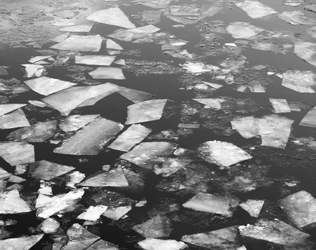 Drifting on the river. Fragments of ice float on the river.