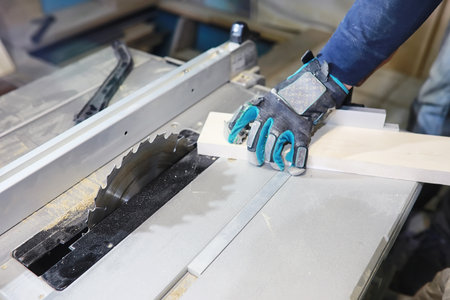 workshop with tools and electric saws in the process of manufacturing partsの写真素材
