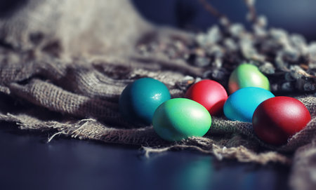 Easter painted eggs on burlap and straw