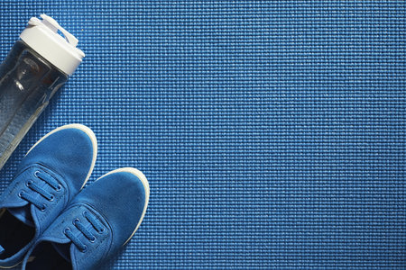 Mat for practicing yoga on a floor. Healthy lifestyle.の写真素材