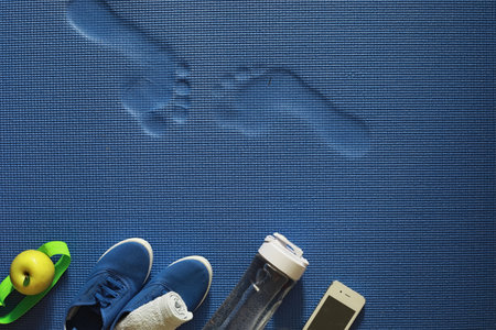 Mat for practicing yoga on a floor. Healthy lifestyle.の写真素材