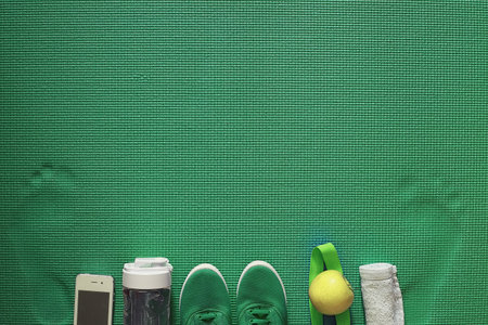 Mat for practicing yoga on a floor. Healthy lifestyle.の写真素材