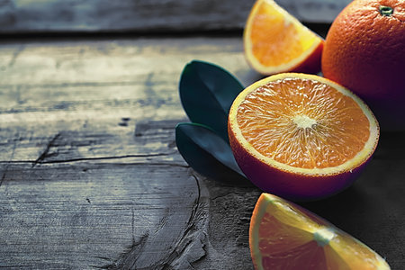 Orange citrus fruit on stone table. Orange background.の写真素材