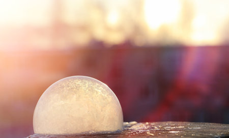 Soap bubbles freeze in the cold. Winter soapy water freezes in air.の写真素材