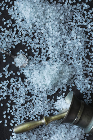 Large sea salt. Spice. Mortar and pestle for grinding salt.
