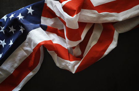 American flag on a black stone background. Space for text.の写真素材