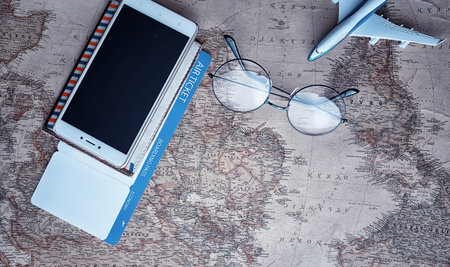 Travel concept. Map on the table and model aircraft.