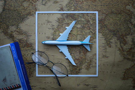 Travel concept. Map on the table and model aircraft.の写真素材