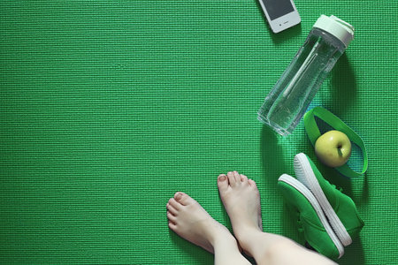 Mat for practicing yoga on a floor. Healthy lifestyle.の写真素材