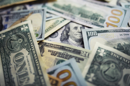 Cash money in a large pile as a finance background. Paper money close up. Top view.の写真素材