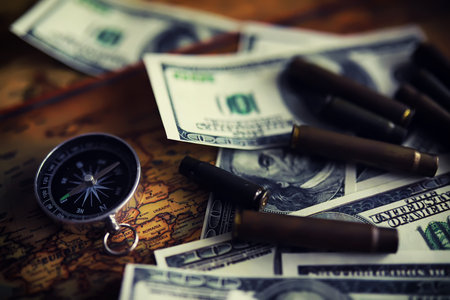 Magnetic compass. The concept of finding successful solutions to problems. Compass, map, sleeves, hands.の写真素材