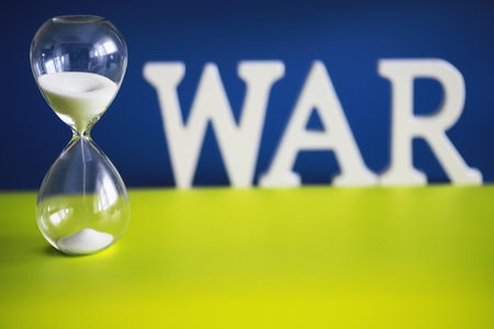 a word war laid by wooden letters dollar banknotes backgroundの写真素材