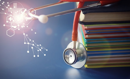 stethoscope on stack of medical guide book for learning doctor treatment hospital.の写真素材