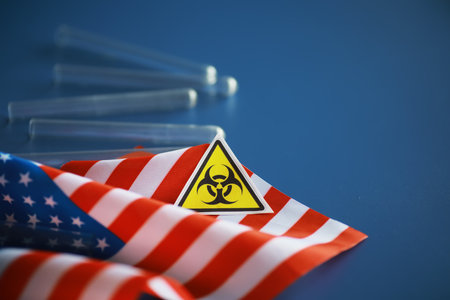American flag and biohazard sign. The concept of American biolabs research centers.の写真素材