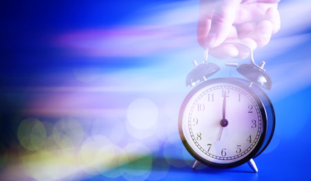 Alarm clock on the table. Time concept. Being late for work school.の写真素材