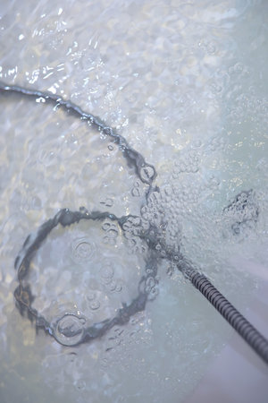 Soap bubbles background. Shampoo foam in the water in the bathroom. bathtub elements.の写真素材
