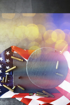American flag on gray background. Military background with bullets. USA and EU collective west.の写真素材
