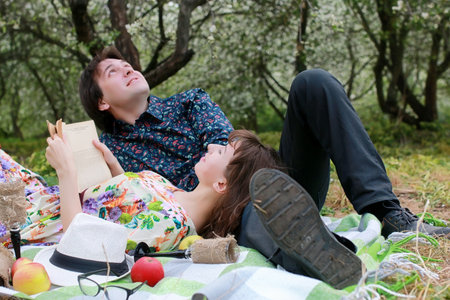 young couple on date in spring park outdoorの写真素材