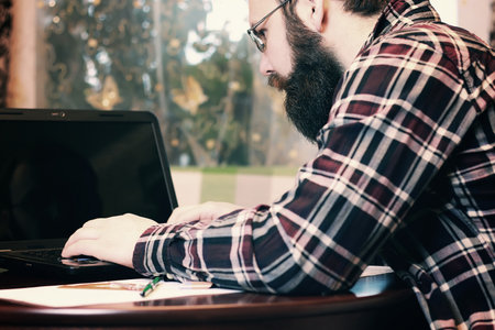 male work notebook beardedの写真素材