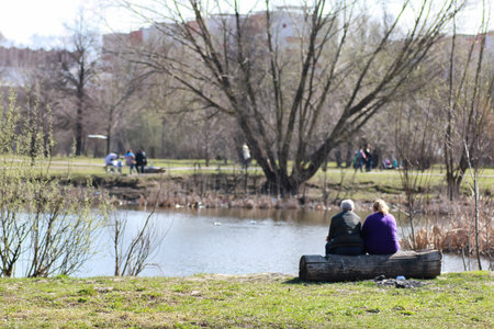 couple back in the parkの写真素材