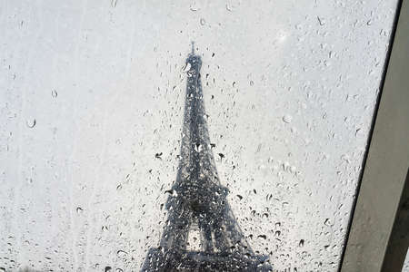 Raindrops on Eiffel Tower background.