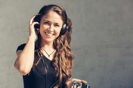 Beautiful girl listening to musicの写真素材